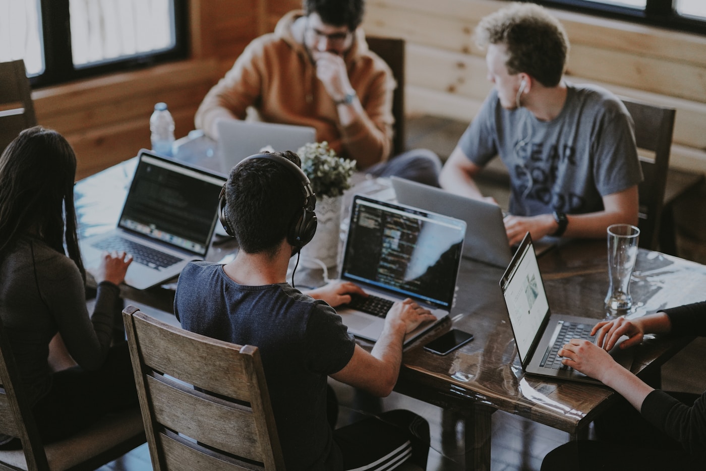 Codinotion support team collaborating in a modern workspace
